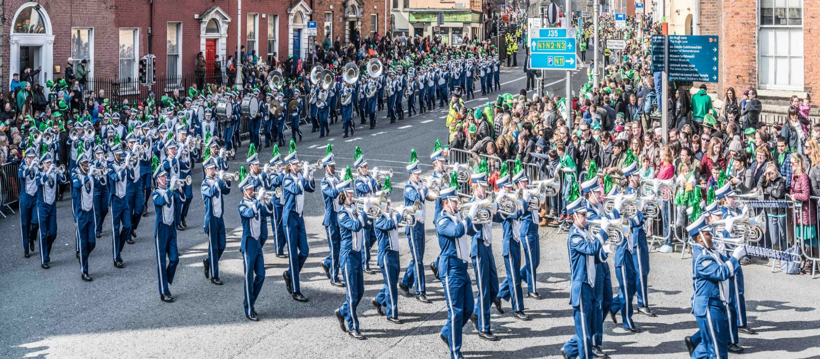 Marching band enjoying st.Patrick's day parade on marching band performance tours of Ireland.