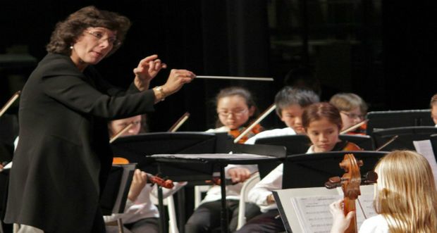 Orchestra conductor on orchestra performance tour