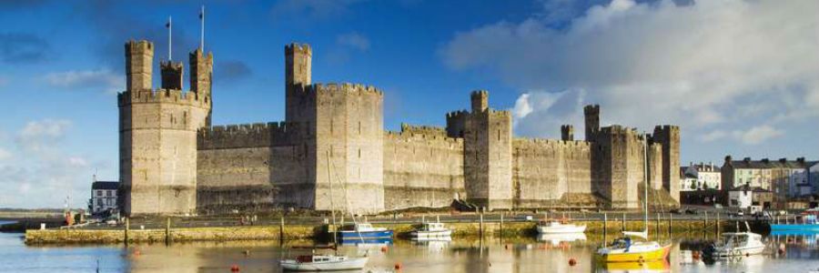 Caernarfon castle is a historic site dominating the town of Caernarfon in Wales.
