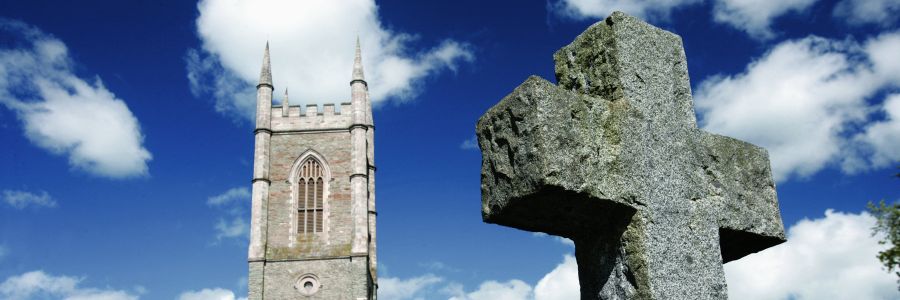 Church and cross on a sunny day in Ireland